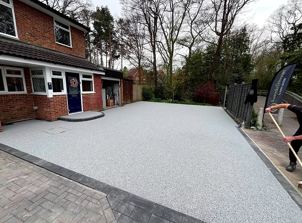 Finished pale resin bound driveway across a residential frontage