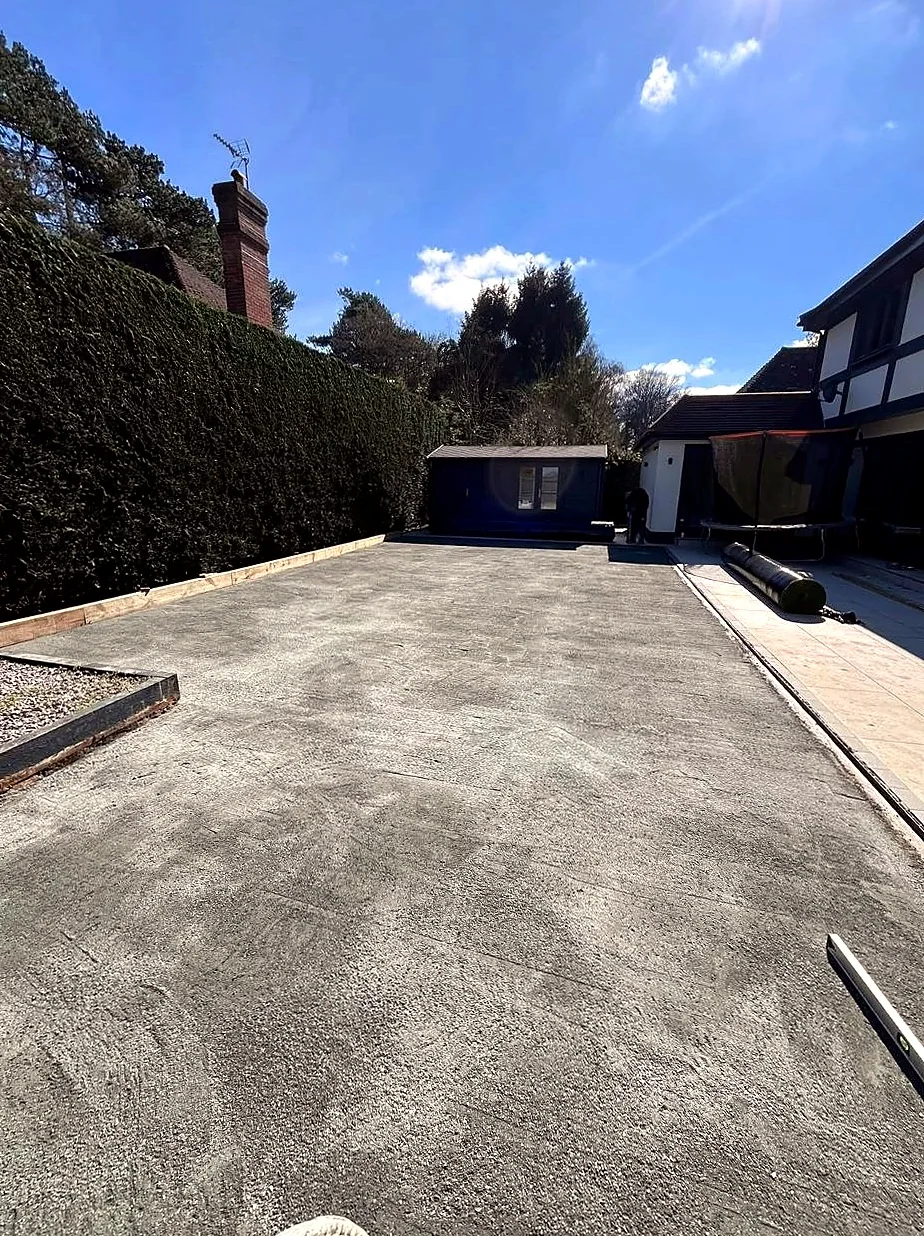 Prepared grey driveway surface with clean edges before final surfacing